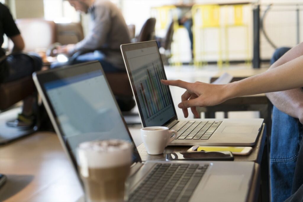 User pointing at laptop screen